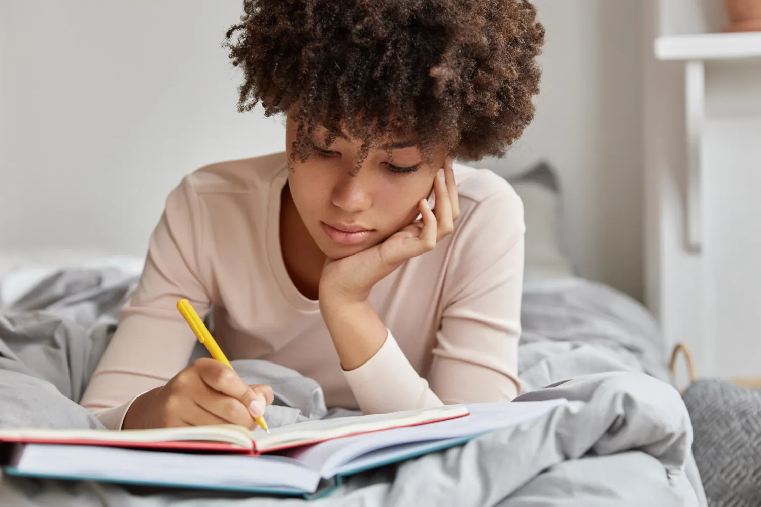 Woman writing in journal